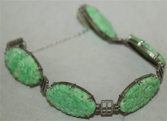 A Chinese jadeite and silver mounted bracelet, 20th century, each jadeite plaque approx. 2.5cm